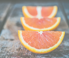 orange slices on wooden table 