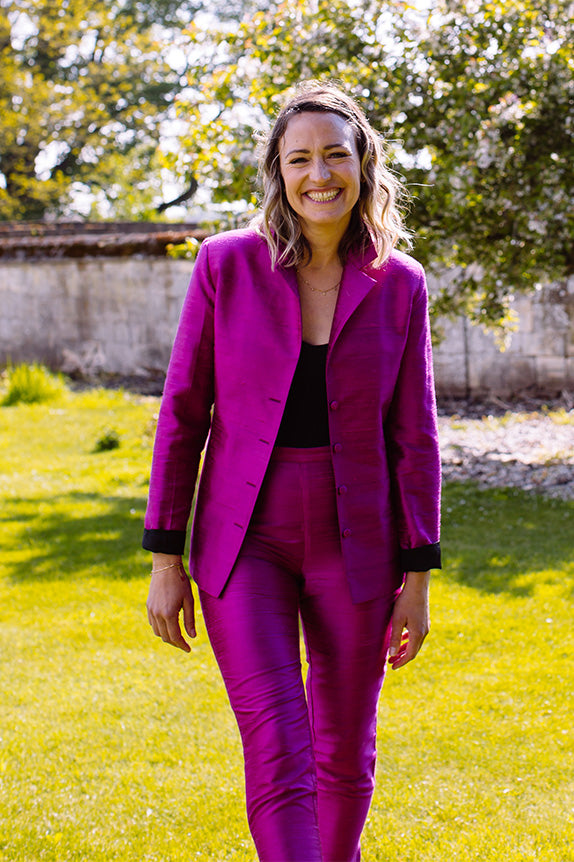 Bridesmaid in pink silk suit