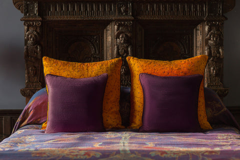 Raw silk cushions and cashmere bed throws