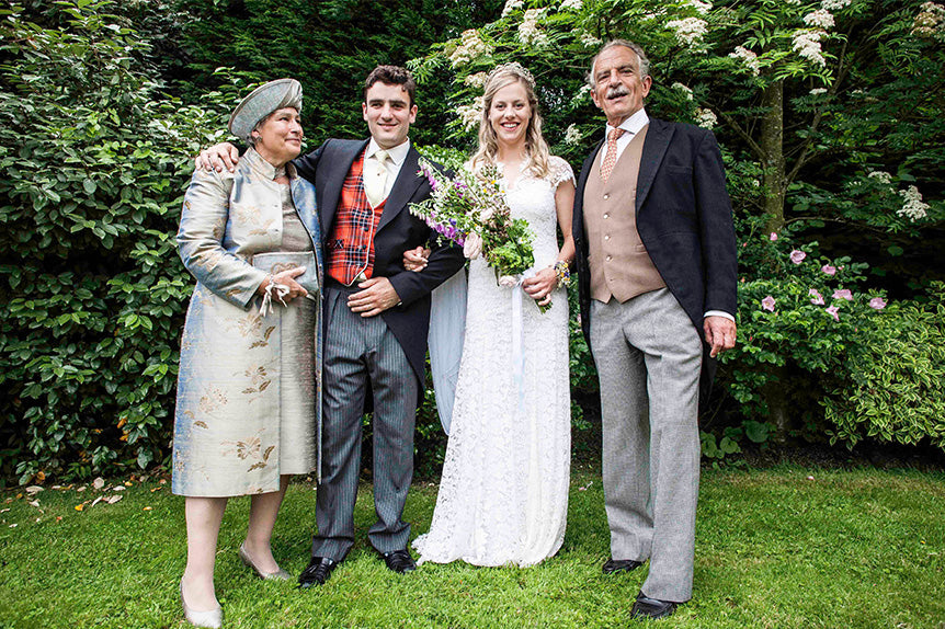 bride and groom with grooms parents, mother of the groom wears a nehru coat in narnia