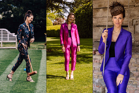 Three pictures of women in silk suits. Woman laughing while playing croquet in a deep blue floral silk suit. A woman standing on grass under a tree wearing a hot pink silk suit. A woman sitting on a rustic wooden swing in a purple silk suit with a leopard print fascinator.