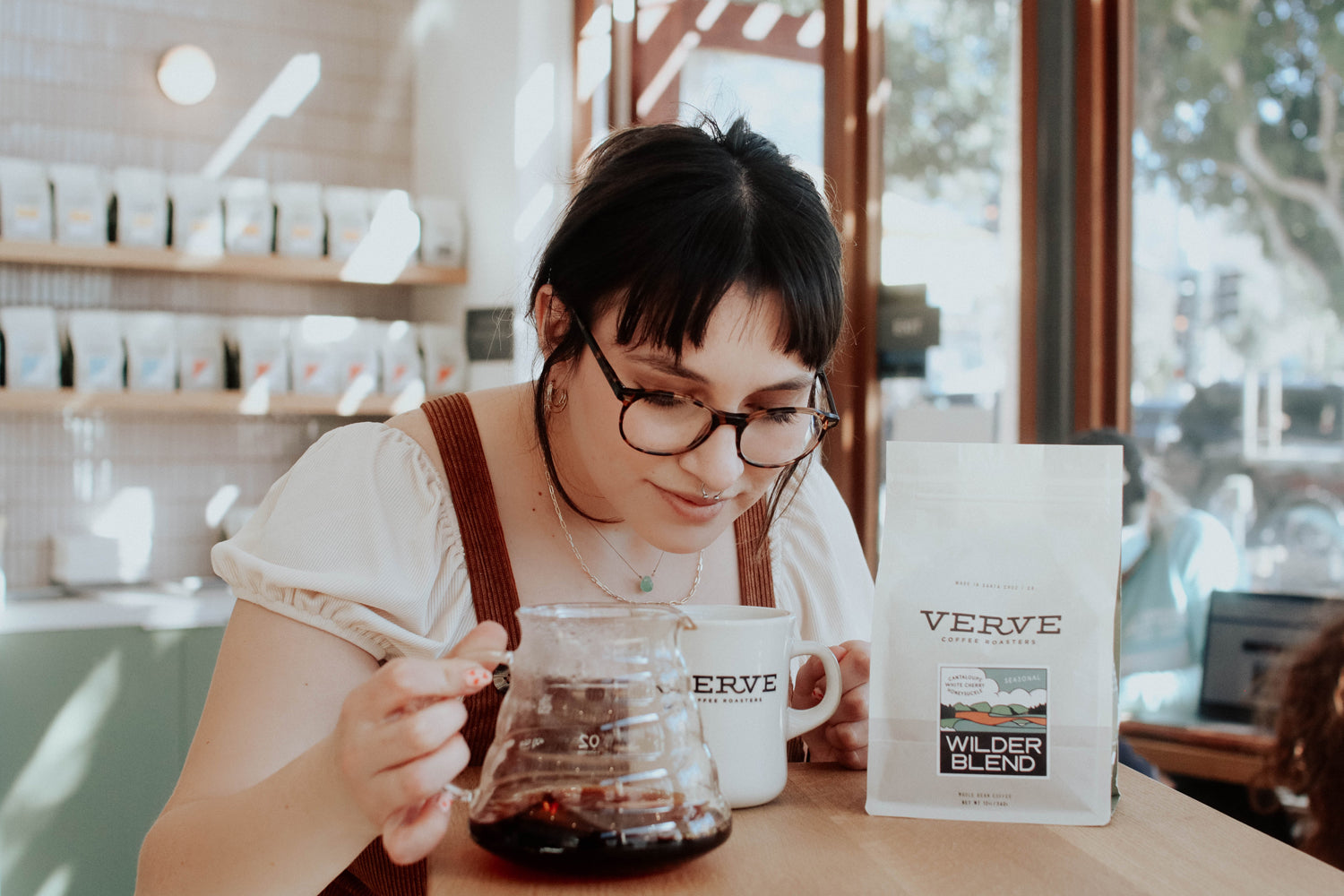 Vanessa smelling the coffee