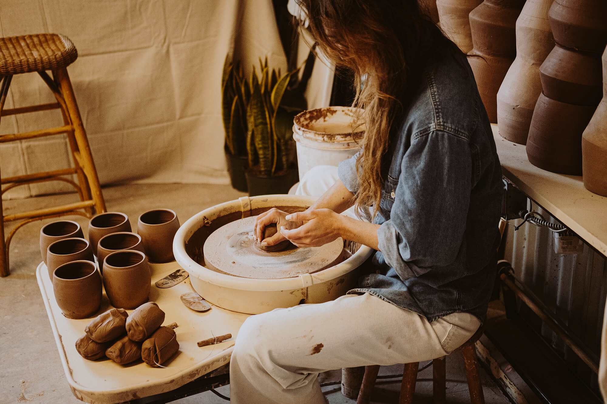 Coco creating her pottery art