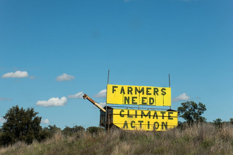 Farmers need climate action - sign on the road side