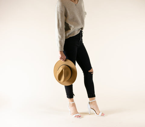 woman posing with white foot wear