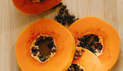 Papaya fruit pieces prepared for a face mask