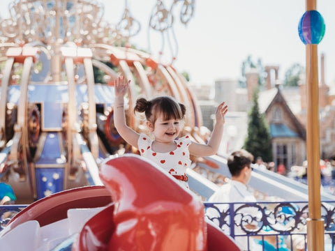A child enjoying a ride at Disney World