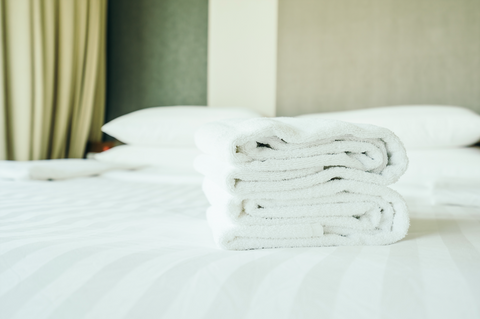 folded towels on bed