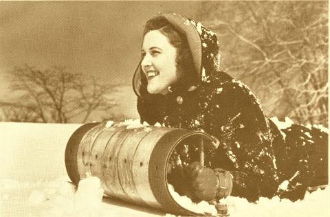 Girl on a Northland Toboggan.