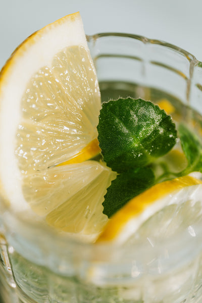 Glass with lemons and mint leaves