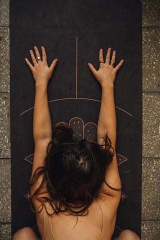 woman stretching on a yoga mat