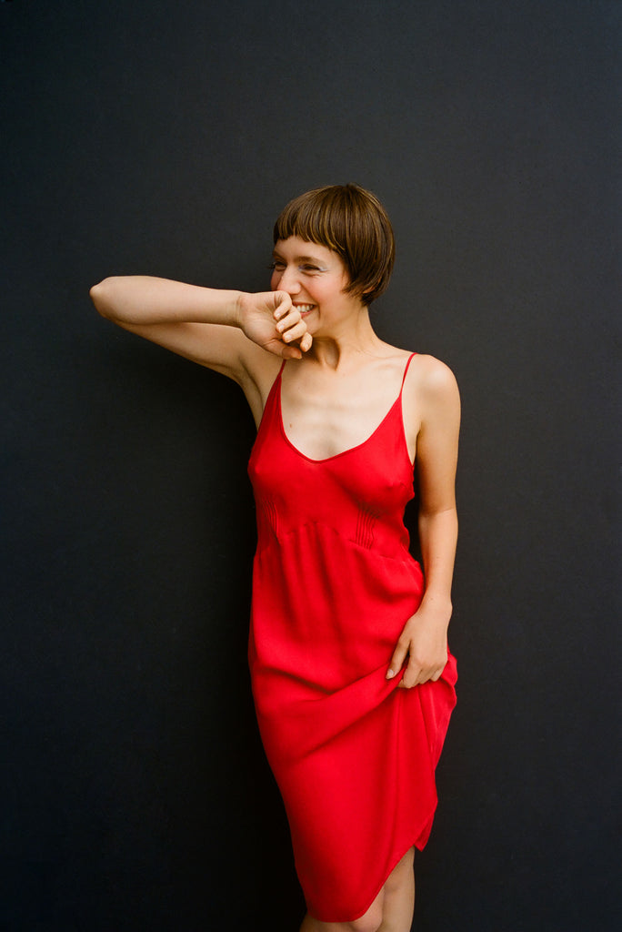 A model wearing the Cadel Slip in Red.