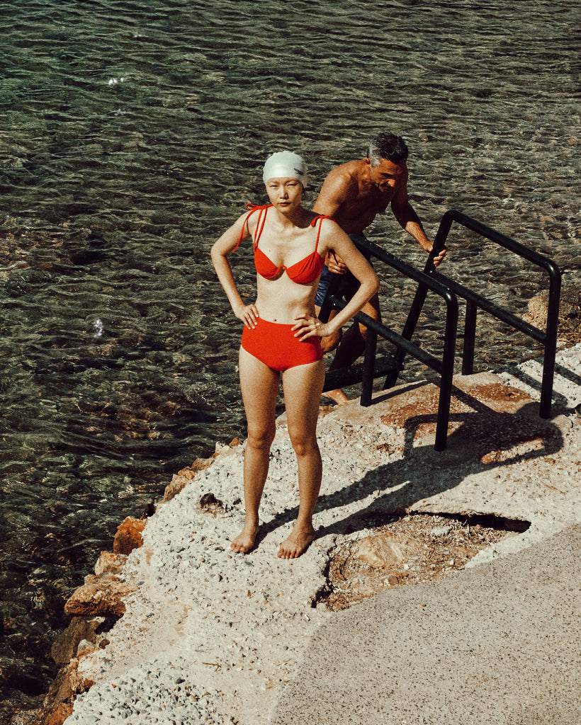 A woman wearing a red bikini.