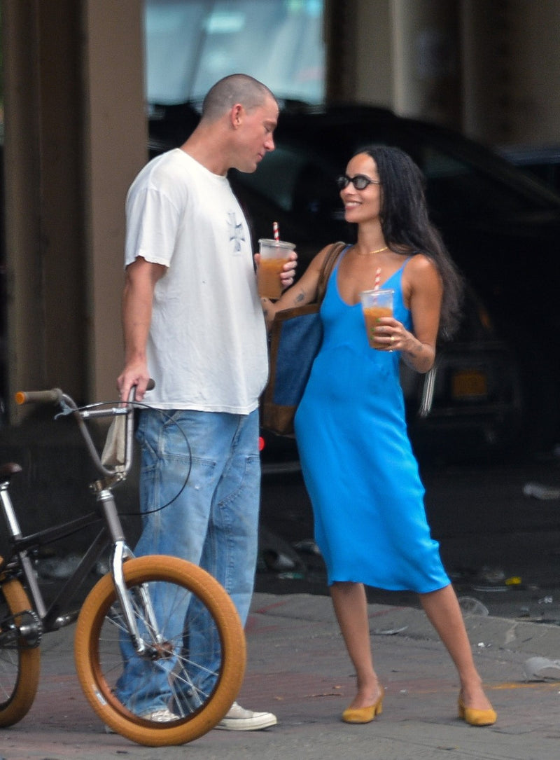 Image of Zoe Kravitz talking to Channing Tatum wearing a Sky blue Cadel slip dress. 