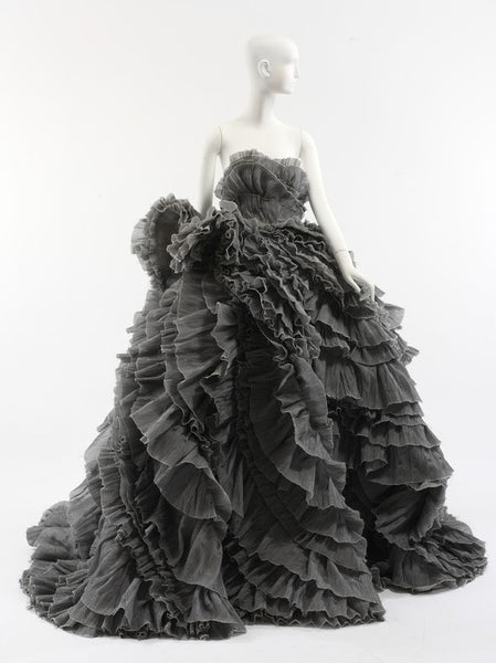 Grey ruffle dress displayed on a mannequin