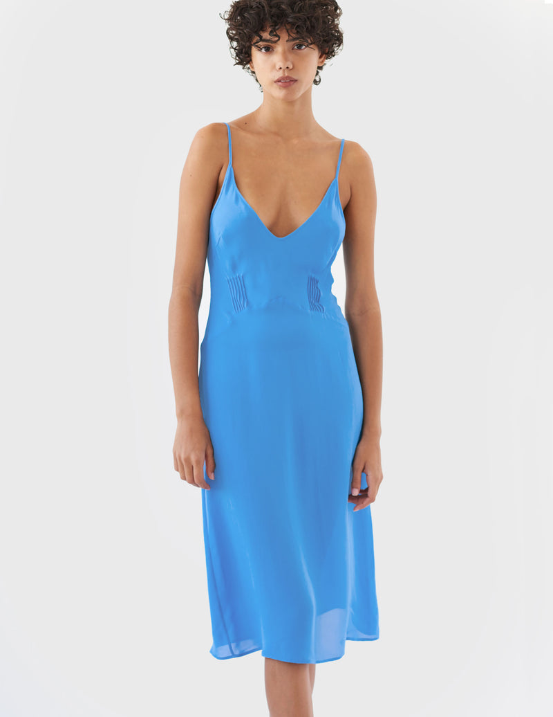 woman wearing blue silk slip