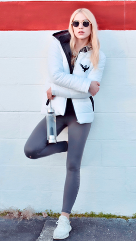 Czarina Ayla wearing a white puffer jacket from Czar Clothing in Nashville, Tennessee.