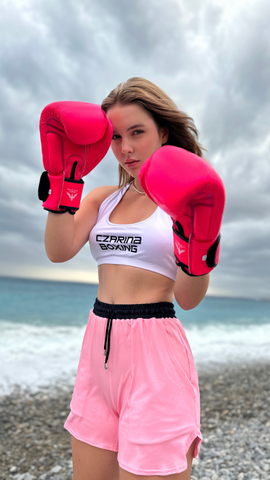 Czarina Sasha wearing boxing athleisurewear from Czar Clothing on the beach in Nice, France.