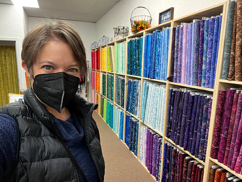 Melanie at the fabric shop starting work on a new image