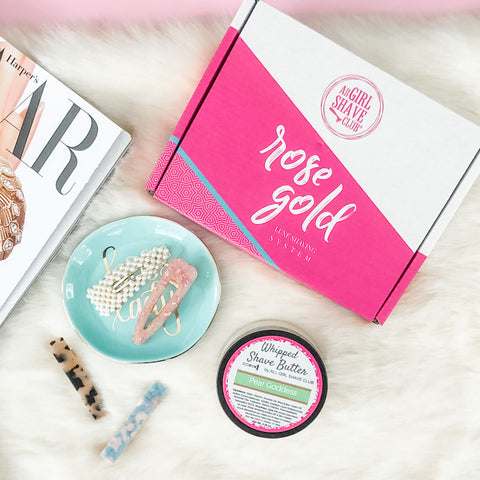 All Girl Shave Club box with shave butter and trending hair clips