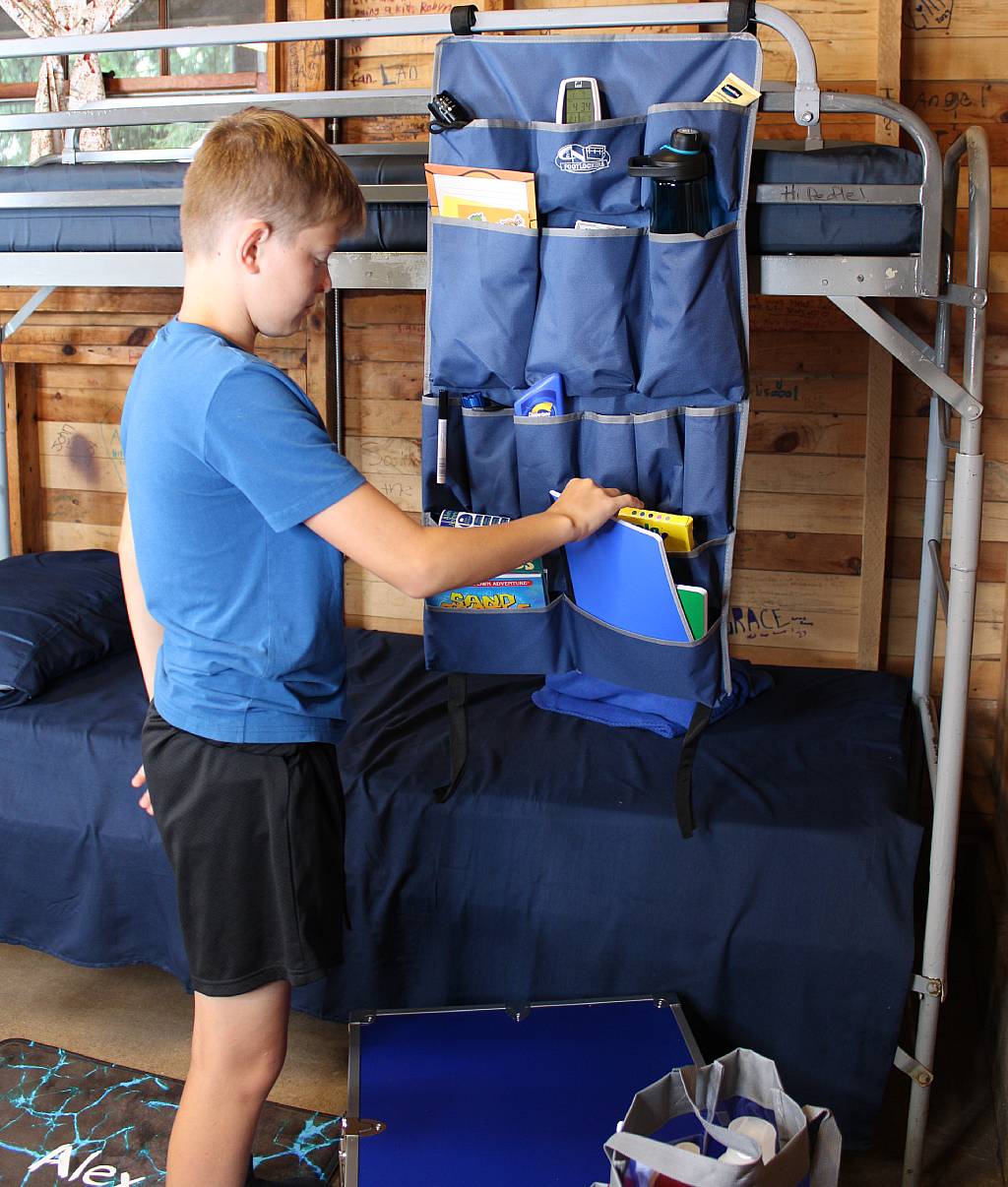 This camper can quickly find daily essentials in his Bunk Organizer!