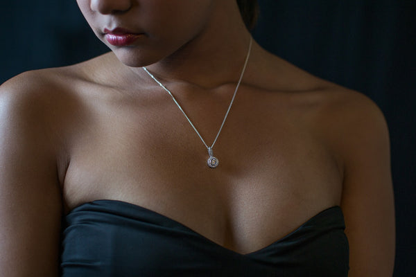 Woman Wearing Diamond Pendant Necklace