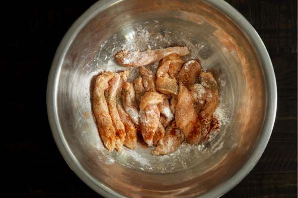 Dry ingredients added to chicken