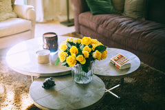 Yellow flowers on a lounge room table – Photo by Maria Orlova from Pexels