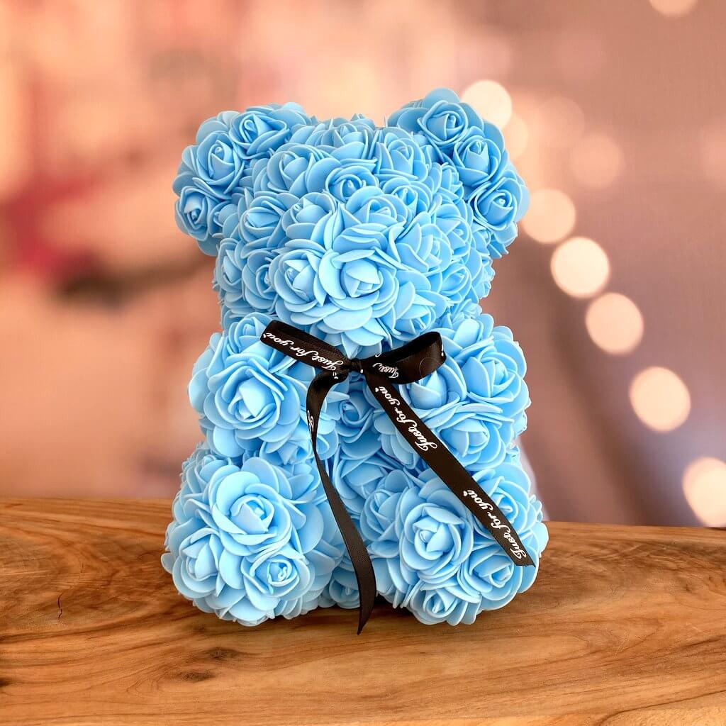 teddy bear with blue roses