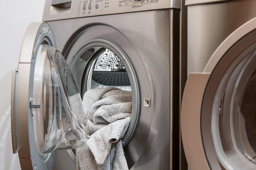 Washing laundry to get rid of bed bugs.