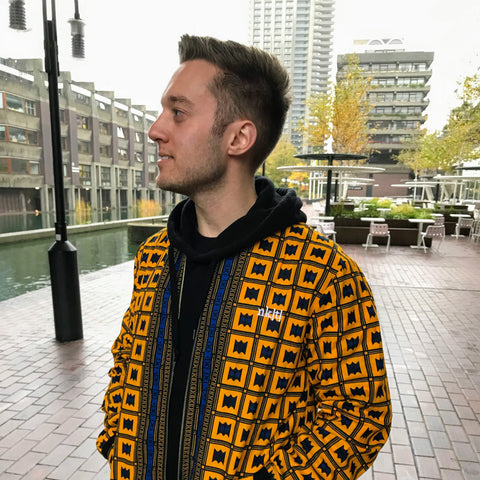 hoodie layered with african print bomber jacket