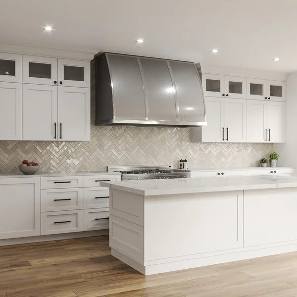 custom stainless steel range hood on white kitchen