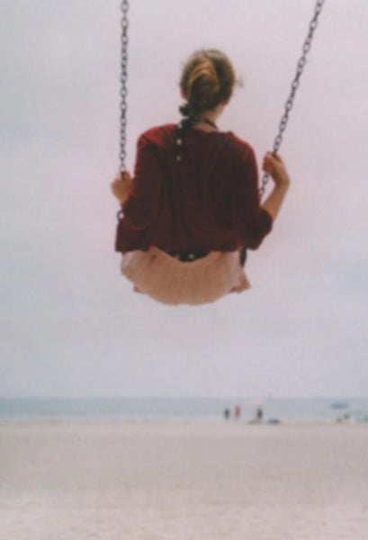 Girl On Swing at the beach