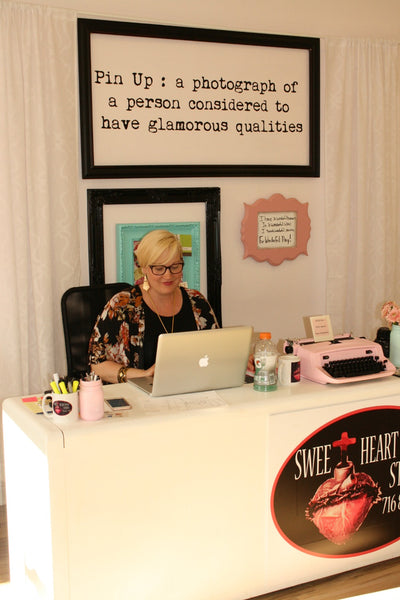 Destiny behind the desk at Sweetheart Pin Up Studio