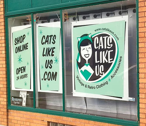 New Cats Like Us signs