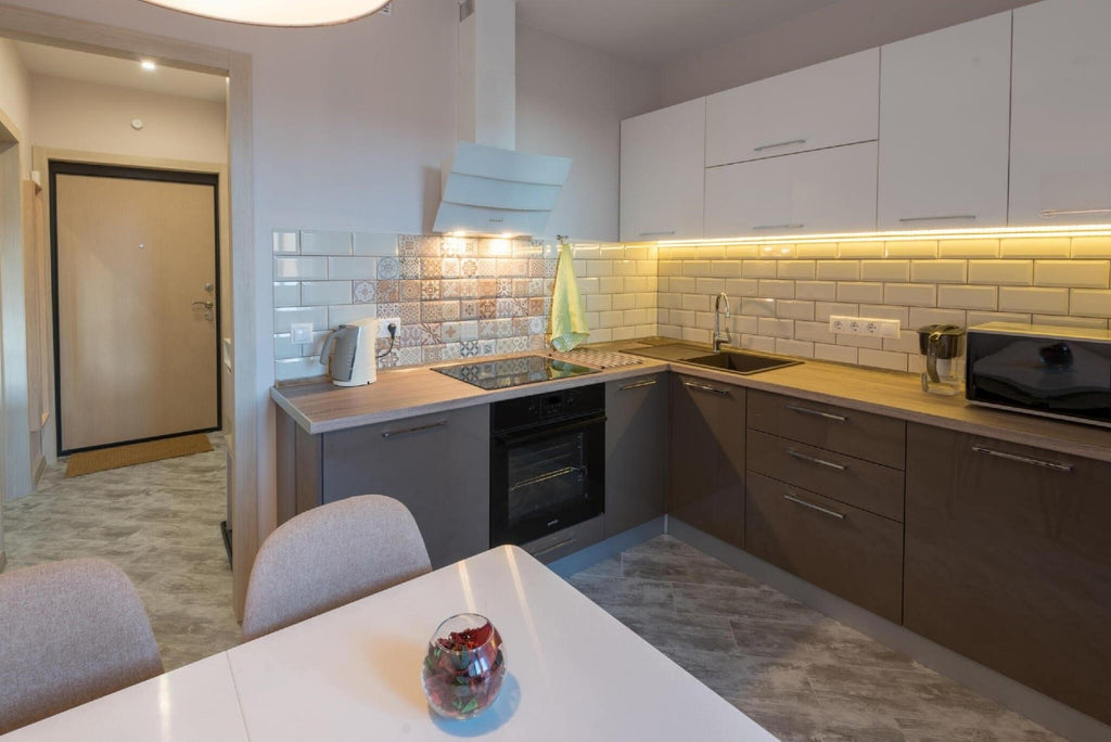 Modern kitchen in the apartment designed with Lepotec under the counter lights.