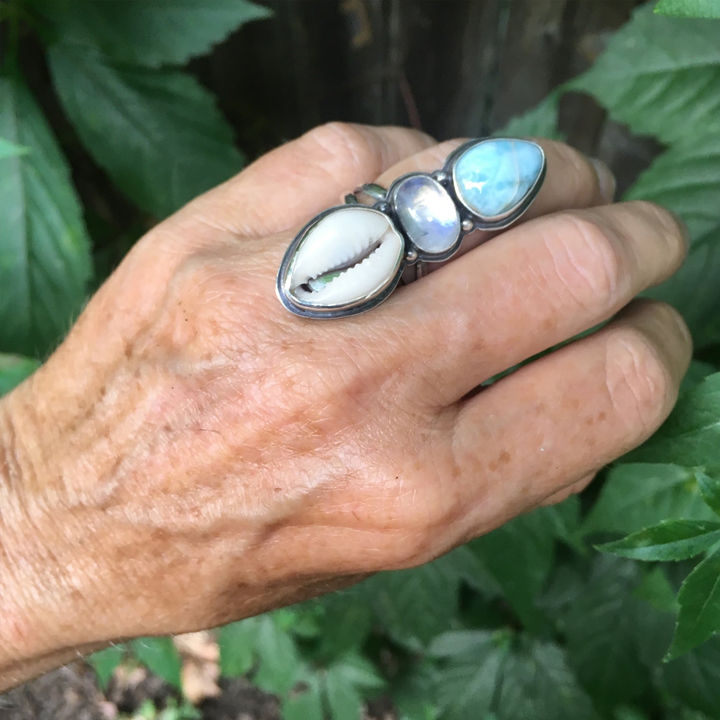 Traveler Trio Ring with Larimar, Rainbow Moonstone and Cowrie Shell Shown on Hand