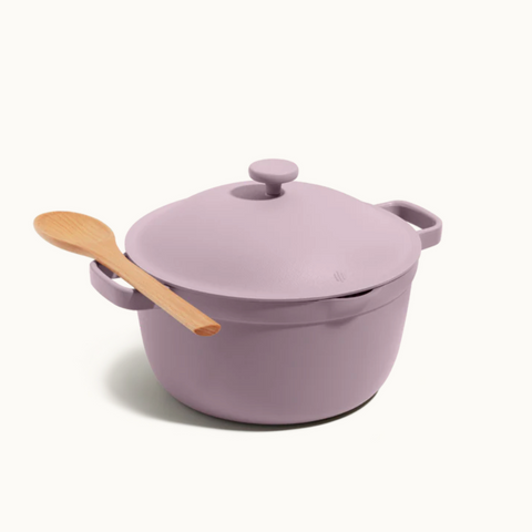 a purple cooking pot with wooden spoon