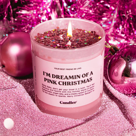 A cute Christmas themed scented candle with a label that reads I'm Dreaming of a Pink Christmas