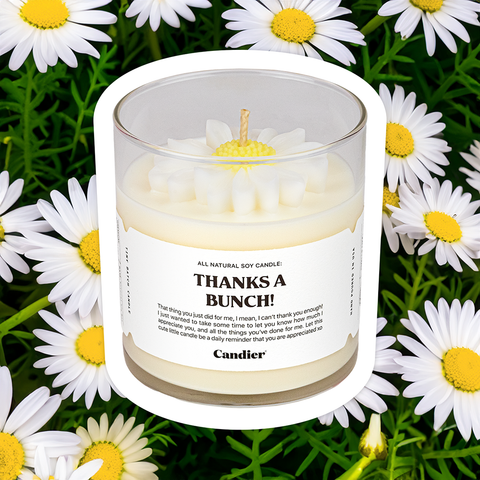 A fun scented candle with a molded flower detail and a label that reads thanks a bunch