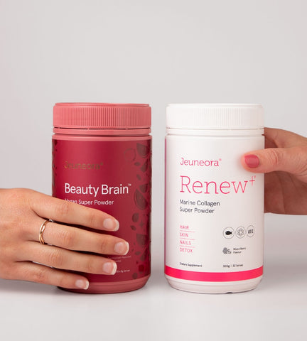 Hands holding beauty supplements, Beauty Brain Vegan Super Powder and Renew+ Marine Collagen Super Powder