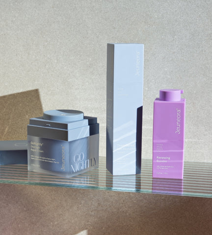 Jeuneora evening skincare products on bathroom shelfie including retinol serum, hydrating serum and night cream.
