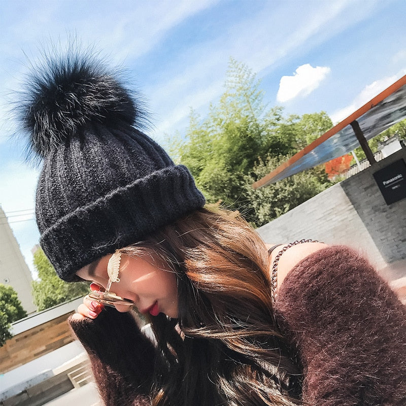 black winter hat with pom pom