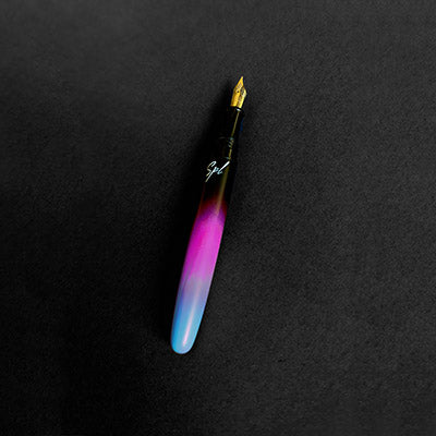 Fountain pen in a black background