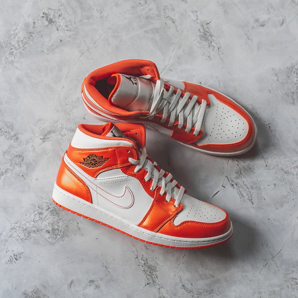 Neon on sale orange jordans