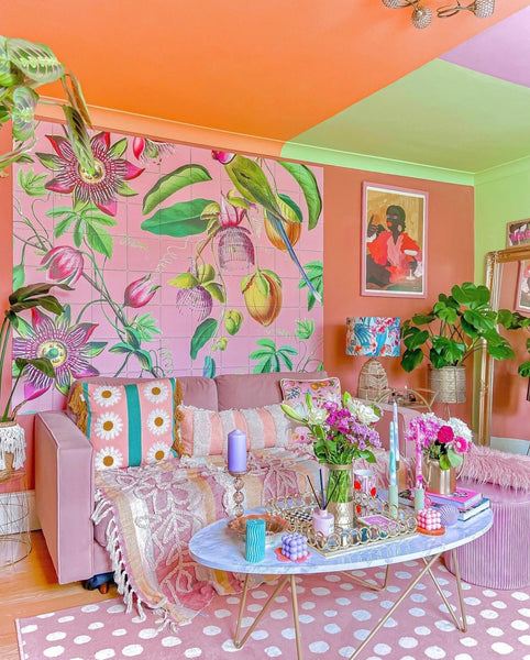 pink and orange living room with floral tropical wallpaper