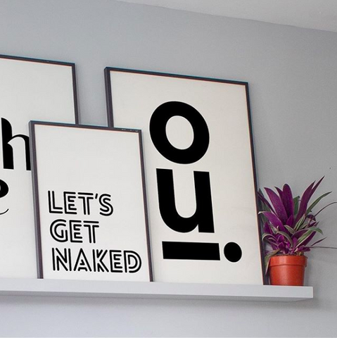 Floating shelf with three monochrome typography prints from Rocket Jack