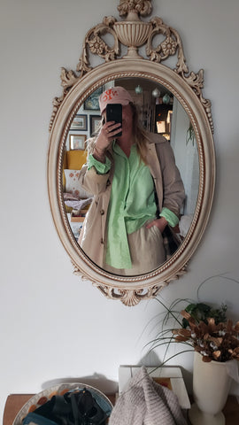 Green button up under trench coat