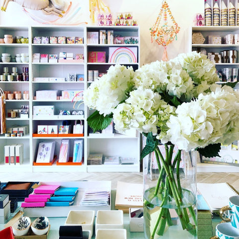 The retail space at Waterlemon kids featuring party supplies and a bouquet of flowers