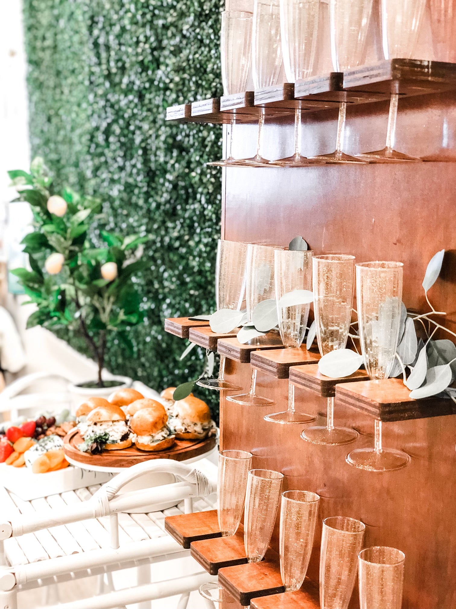 A champagne wall for a gender reveal party